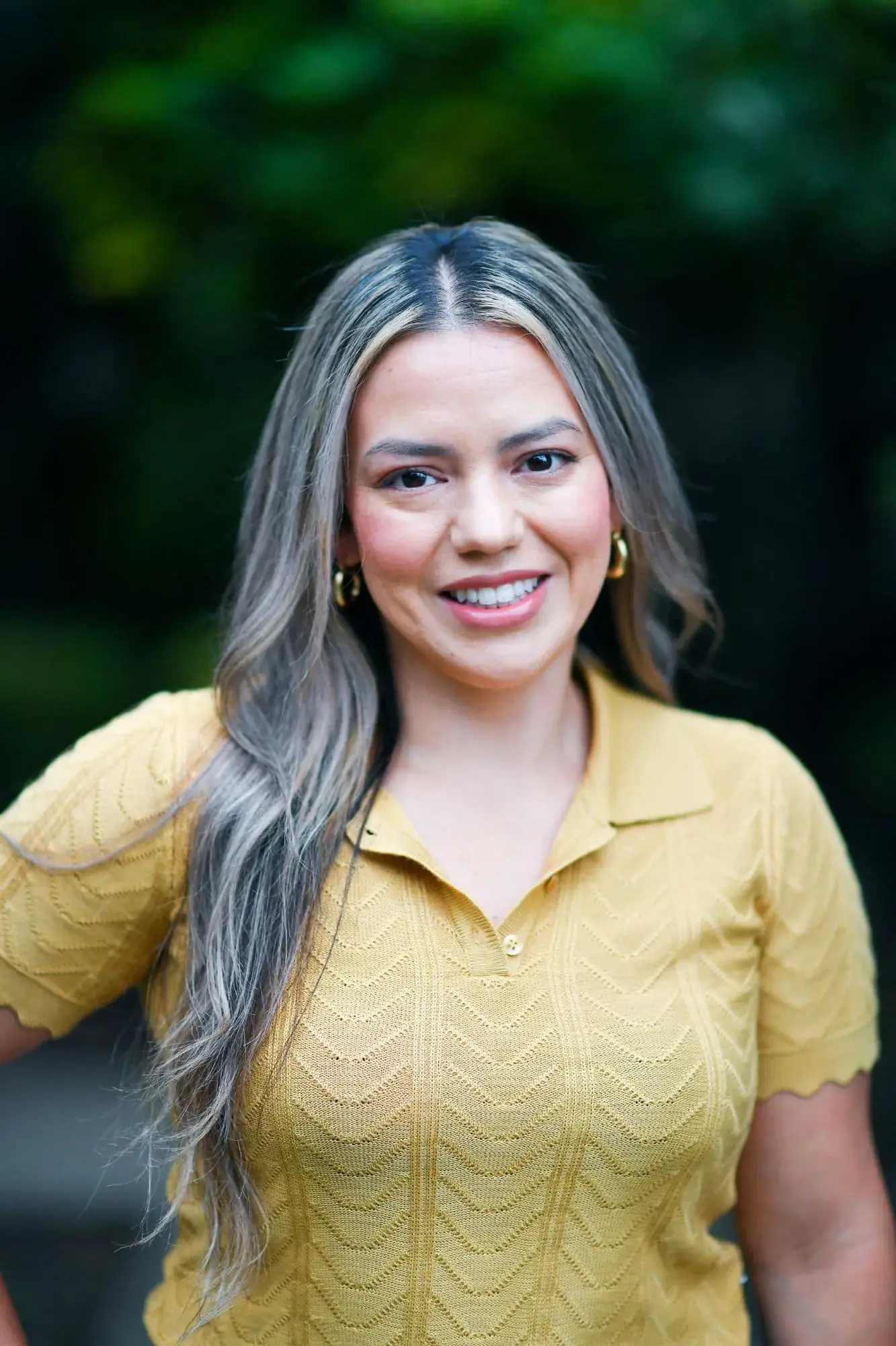 A patient smiling confidently showing the result after a treatment at Freelove Orthodontics Kent or Sammamish, WA