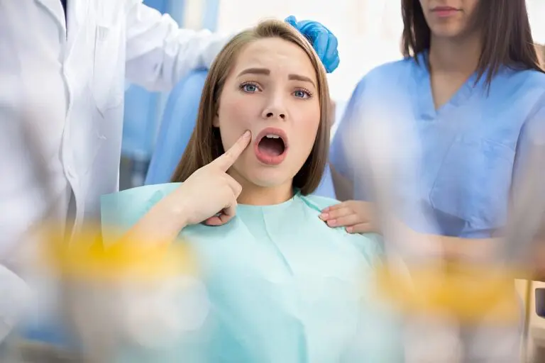 girl in dental ambulance show sore spot - TMJ Treatment in Kent and Sammamish, WA